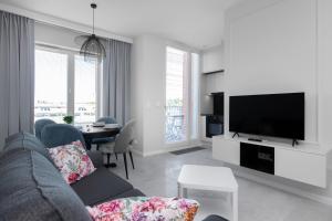Televízia a/alebo spoločenská miestnosť v ubytovaní City Break Gdańsk Rajska 8 Apartamenty