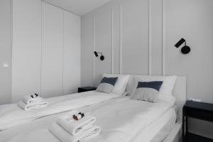 Posteľ alebo postele v izbe v ubytovaní City Break Gdańsk Rajska 8 Apartamenty