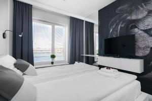 Posteľ alebo postele v izbe v ubytovaní City Break Gdańsk Rajska 8 Apartamenty