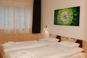 Chalet Glemmtal - Haus Schmittenblick tesisinde bir odada yatak veya yataklar