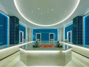 a large room with blue walls and a table at Sundia By Liberty Oludeniz in Oludeniz