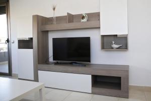 TV a/nebo společenská místnost v ubytování AT143 Completamente equipado, con piscina y cerca de la playa
