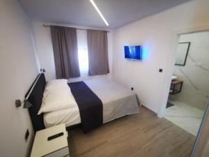 Postel nebo postele na pokoji v ubytování SPA Apartment Vito