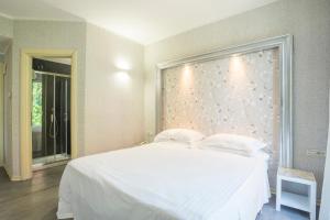 En eller flere senger på et rom på Hotel Repubblica Marinara