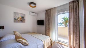מיטה או מיטות בחדר ב-Rooms & Apartments Toni