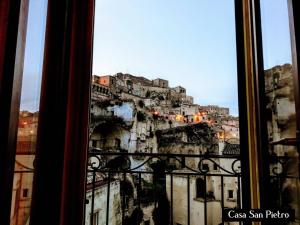 a view of a city from a window at Cave Rooms Sassi in Matera
