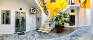 a group of buildings with stairs and a door at CASA VACANZA RESILIENZA in Marsala