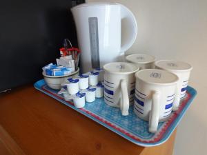 a tray with a bunch of cups and a blender at Travellers Rest Motel in Ingoldmells