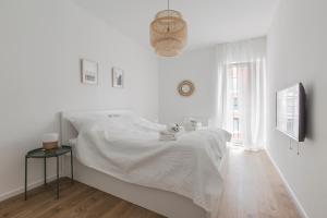 Posteľ alebo postele v izbe v ubytovaní City Break Gdańsk Rajska 8 Apartamenty