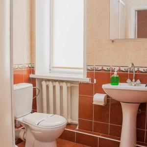 a bathroom with a toilet and a sink at Готельний комплекс Самікс in Kyiv +25 photos