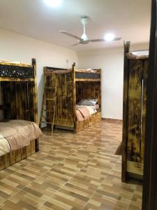 
a bedroom with a bed and a dresser at Hakaia Community in Aqaba
