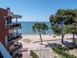 a view of the beach from a building at Apartaments Voralmar - Mas d'en Gran in Cambrils