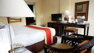 Voodi või voodid majutusasutuse The Jayakarta Yogyakarta Hotel & Spa toas
