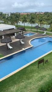 Bazén v ubytování Praia do Forte - Apartamento no Iberostar belíssimo nebo v jeho okolí