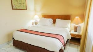 Voodi või voodid majutusasutuse The Jayakarta Yogyakarta Hotel & Spa toas