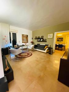 a living room with a couch and a table at CASA GARIBALDI 162 in Leverano