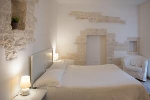 A bed or beds in a room at Charming Trulli
