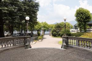 a bridge over a walkway in a park at Loft Cedro, by R Collection Apartments in Como