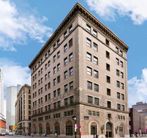 a large brick building on a city street at Harmony Medical Suites ChinaTown in Boston