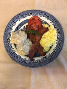 a plate of breakfast foods on a table at Folkestone Inn in Bryson City