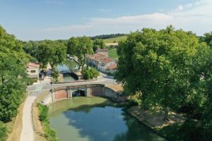 an aerial view of a bridge over a river at Maison Monxanin in Gardouch