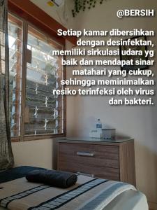 Postel nebo postele na pokoji v ubytování GIO Guesthouse Bogor