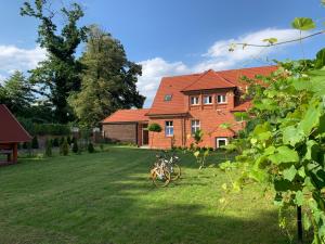 a house with a bike parked in the yard at Willa Starowiejska in Racibórz