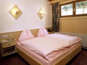 Ένα ή περισσότερα κρεβάτια σε δωμάτιο στο Haus Granbichler