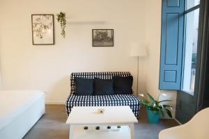 a living room with a couch and a table at Girona Santa Clara in Girona