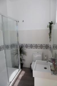 a bathroom with a shower and a toilet and a sink at Girona Santa Clara in Girona