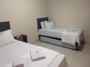 Krevet ili kreveti u jedinici u okviru objekta Hotel Vale Do Ivinhema
