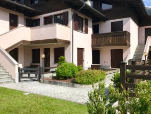 a house with a fence in front of it at Chalet Bormino 5 in Bormio