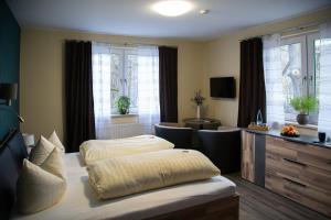 Ein Bett oder Betten in einem Zimmer der Unterkunft Sporthotel Wernigerode