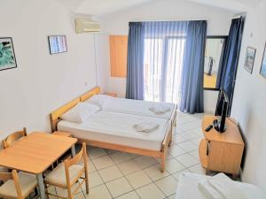 Postel nebo postele na pokoji v ubytování Guesthouse Villa Paškal + 37 fotografií