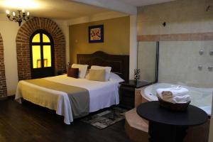 Ένα ή περισσότερα κρεβάτια σε δωμάτιο στο Spa Holistico Real Hotel