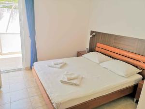 Postel nebo postele na pokoji v ubytování Guesthouse Villa Paškal
