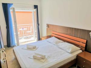 Postel nebo postele na pokoji v ubytování Guesthouse Villa Paškal