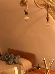 Postel nebo postele na pokoji v ubytování Il Galletto Viola, luxury room & suite