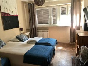 Cama o camas de una habitación en Apartament Słodowiec