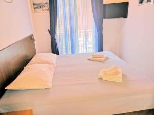 Postel nebo postele na pokoji v ubytování Guesthouse Villa Paškal