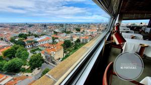 a view from a balcony of a building with a view of a city at Hotel Miradouro in Porto