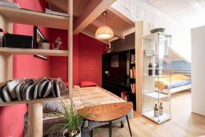 a bedroom with red walls and a bed in a room at White Tower of Love in Bressanone