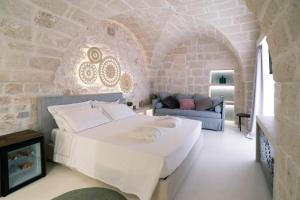 Posteľ alebo postele v izbe v ubytovaní Palazzo Vico Bianco Raro Villas Homes Collection
