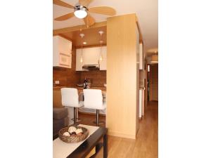 a kitchen and dining room with a ceiling fan at Aloe Friendly Holiday Home in Playa del Ingles