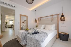 Sea & Olives Suites Hotel and Villas客房内的一张或多张床位