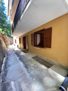 a building with a window on the side of it at DOWNTOWN MADESIMO in Madesimo