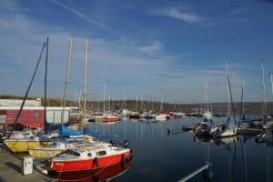 a bunch of boats docked in a harbor at Warias Hotel & Restaurant in Braunsbedra