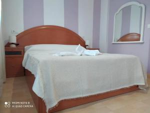 Giường trong phòng chung tại Apartamento Santa Ana Ronda