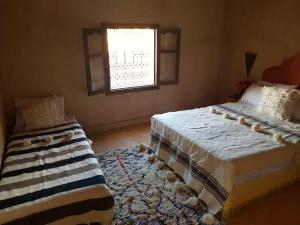 Cama o camas de una habitación en Kasbah Erg Chebbi