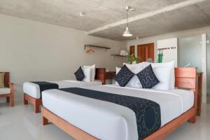 Postel nebo postele na pokoji v ubytování Wabi Sabi Boutique Hotel - SHA Extra Plus